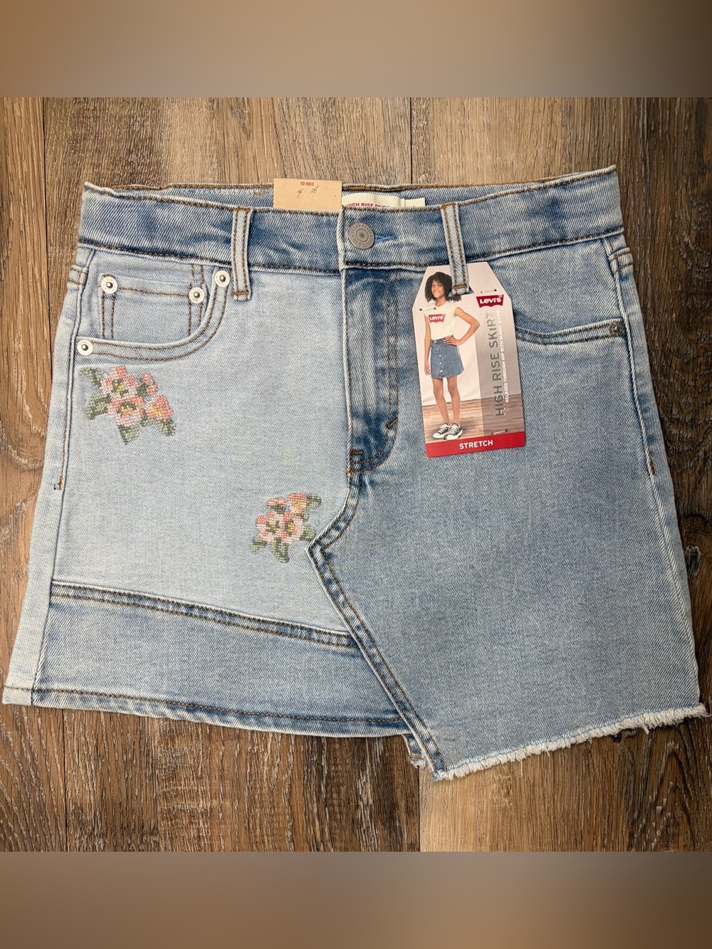 Levi's light blue high-rise denim skirt with red logo tags, girls size 10